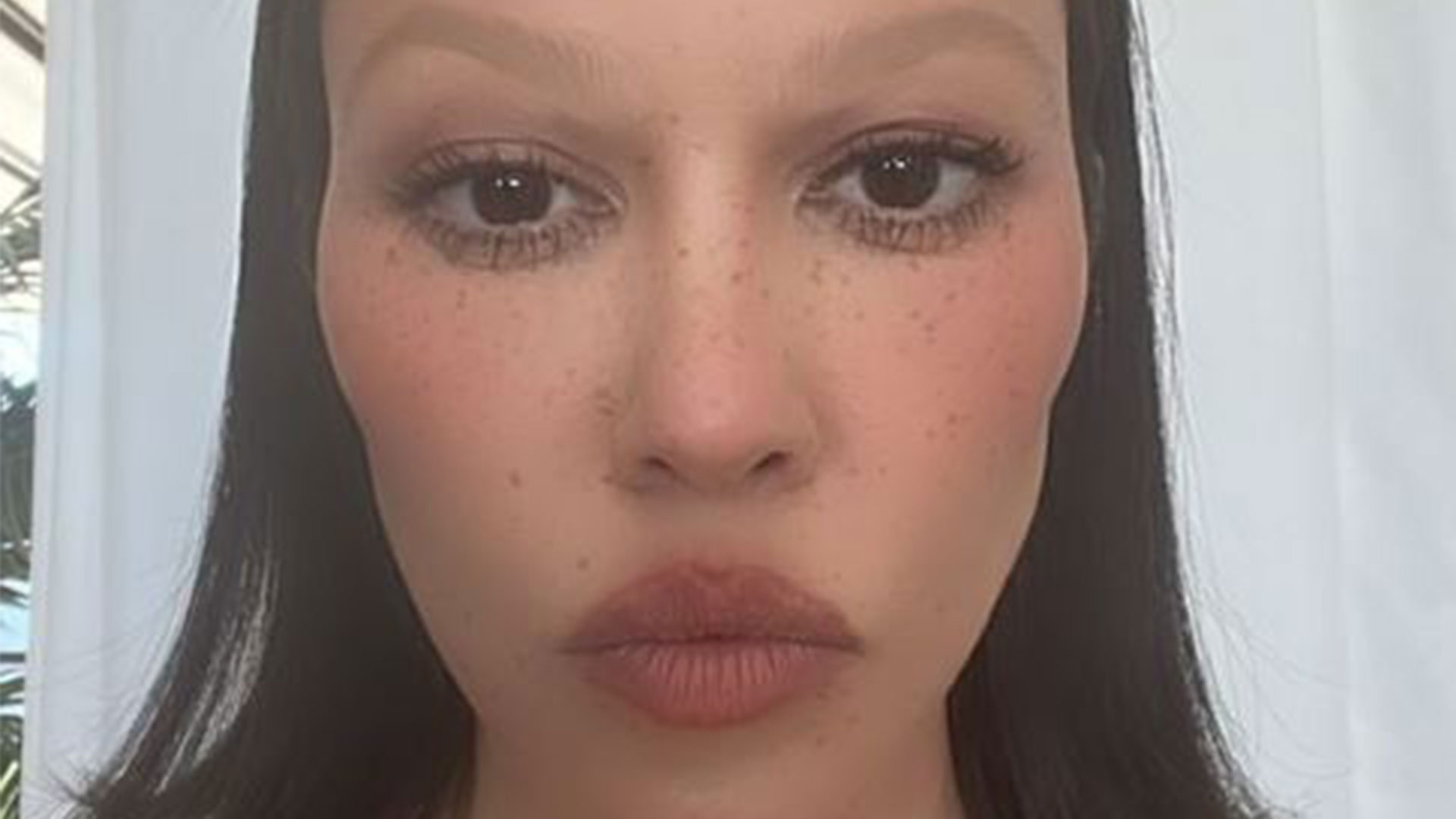 Kourtney Kardashian seems unrecognizable with huge lips & freckles in new pic after star rips cosmetic surgery rumors